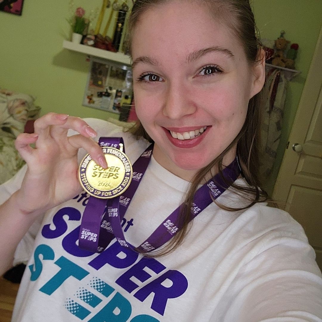 Mackie with her Super Steps medal