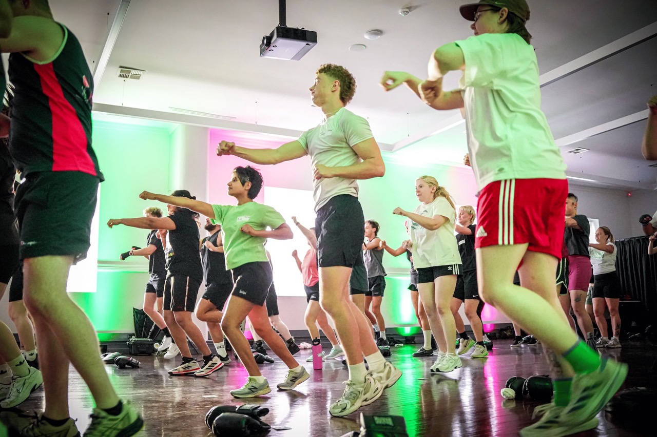 Rooms full of people boxing